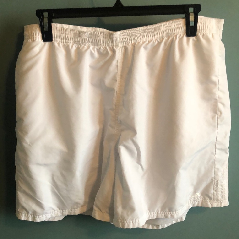 Men’s adidas athletic shorts with pockets.